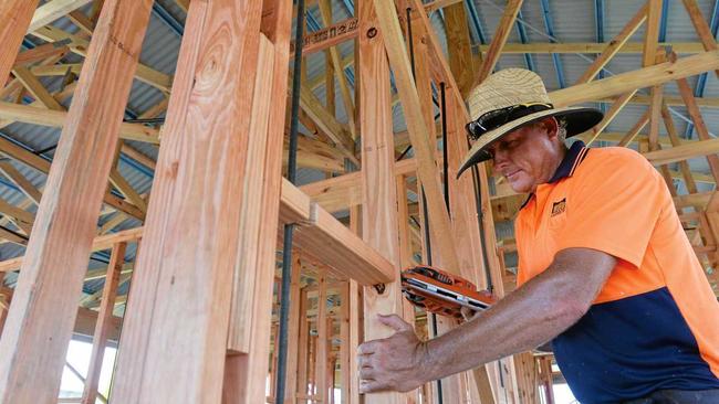 LONE TRADIE: Carpenter Warren McBean frames a house at Royal Sands. Developers of the Bucasia estate say they need at least another four tradies to get ahead of the demand for new houses, that will result in construction starting on a new home every fortnight until the end of June. Picture: Tony Martin