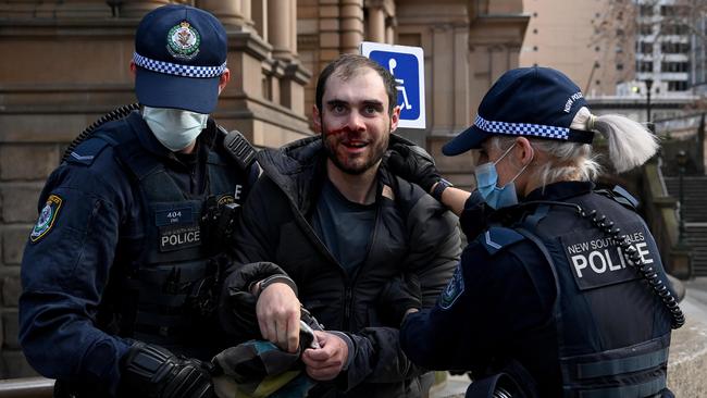 Protesters clash with NSW Police officers at Town Hall during a protest to rally for freedom of speech, movement, choice, assembly, and Health in Sydney. Picture: NCA NewsWire/Bianca De Marchi