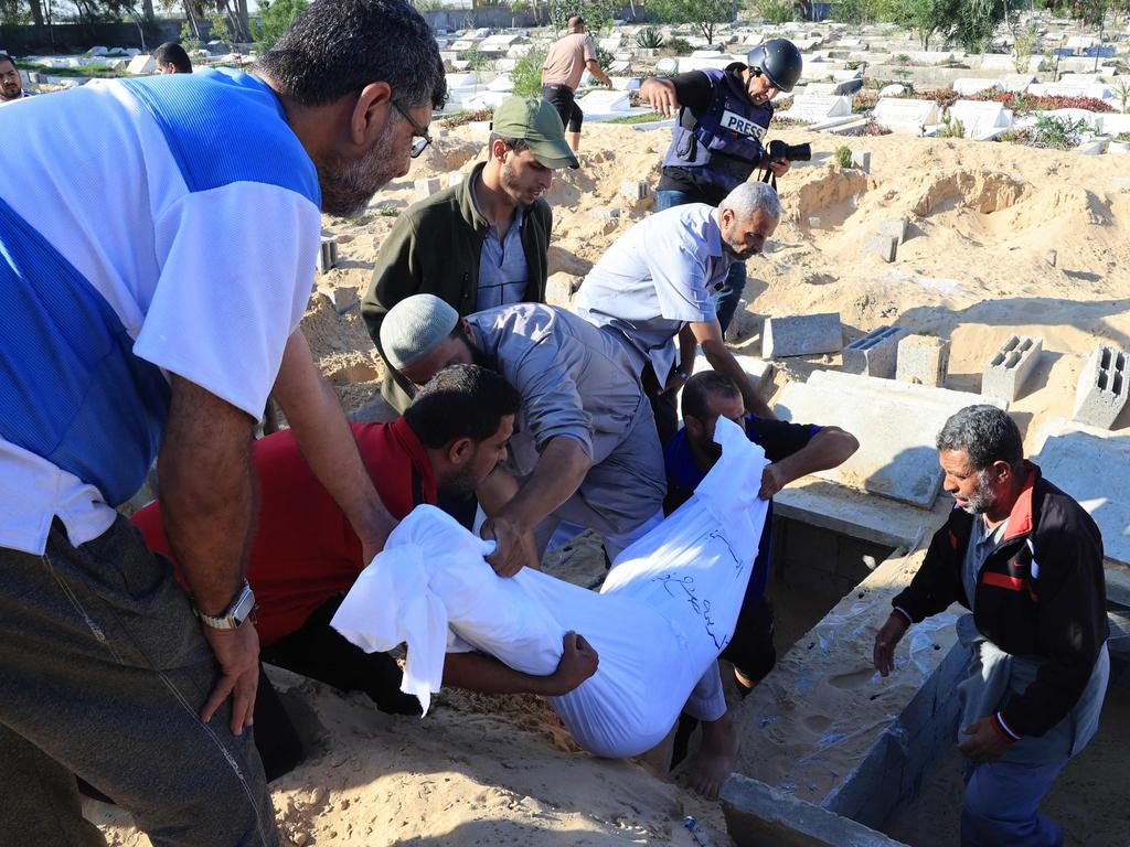 Mourners carry the body of a member of the Zannoun family who was killed in an Israeli air strike. Picture: AFP