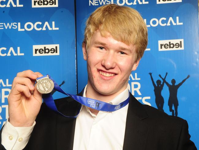 Snowboarder Jarryd Hughes with his Junior Sports Star medal in 2013.