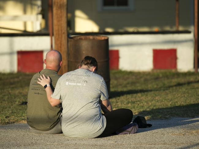 A couple comfort each other at a community centre in Sutherland Springs, Texas. Picture: AP