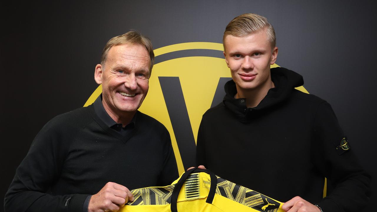 Hans-Joachim Watzke, CEO of German Borussia Dortmund, poses with the club's new recruit, Norwegian forward Erling Braut Haaland.