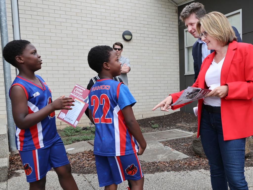 Young kids talk to Premier Jacinta Allan and Labor candidate John Lister at a polling booth. Picture: David Crosling