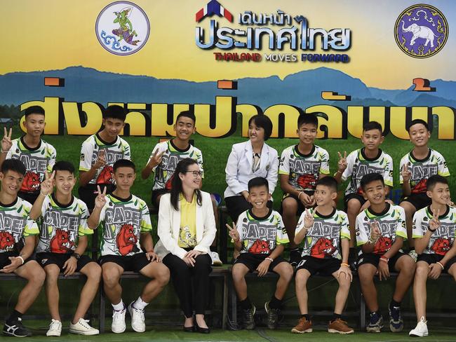 The young footballers and their coach looked healthy when they appeared before the media for the first time on July 18.