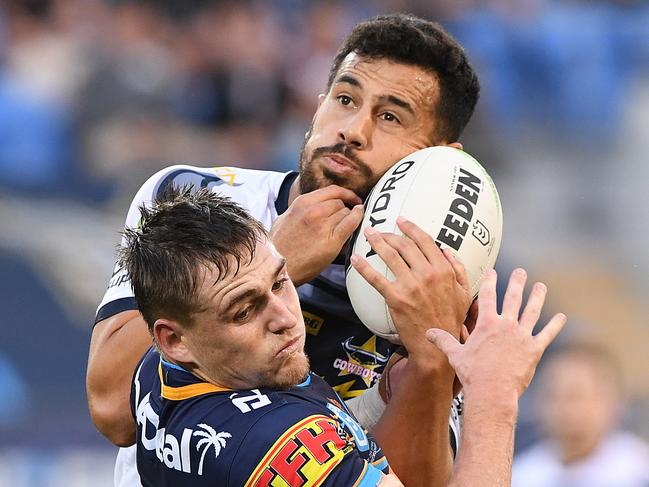 A J Brimson of the Titans (left) contests a high ball with Jordan Kahu of the Cowboys  during the Round 12 NRL match between the Gold Coast Titans and the North Queensland Cowboys at CBus Super Stadium on the Gold Coast, Sunday, June 2, 2019. (AAP Image/Dave Hunt) NO ARCHIVING, EDITORIAL USE ONLY