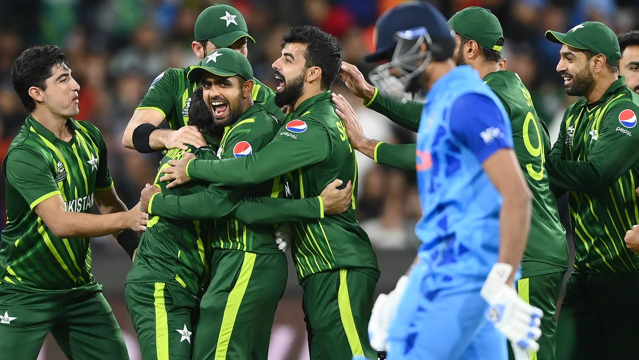 Pakistan players celebrate running out Axar Patel. Photo by Quinn Rooney/Getty Images