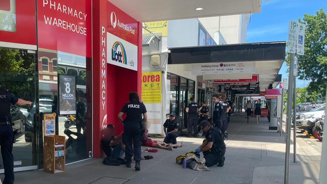 Nine police officers handcuffed four men on Lake Street in the Cairns CBD on Lake St earlier this year.