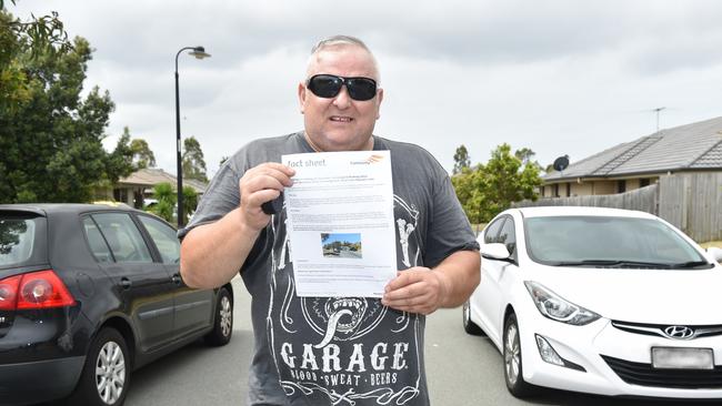 Steven Lovli with a council letter warning against illegal parking at his Denham Crescent property in North Lakes. Picture: Marcel Baum