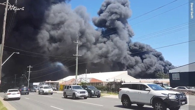 Factory fire turns the sky black