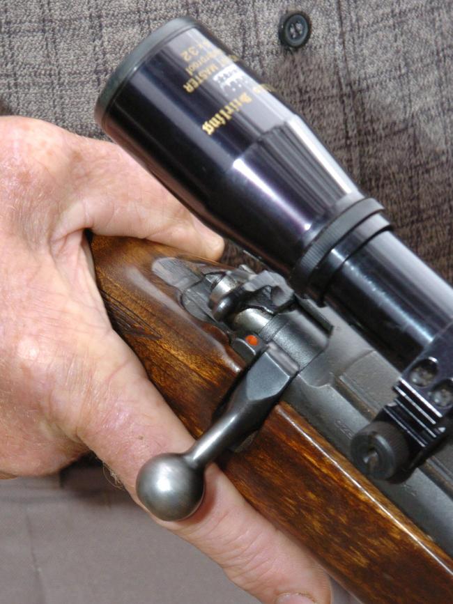 A farmer holds the gun he uses to kill koalas with on his K.I. property. Re: story on the culling of Koalas by farmers on Kangaroo Island.