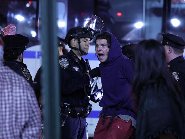 NYPD officers arrest students as they evict a building that had been barricaded by pro-Palestinian student protesters at Columbia University, in New York City. Picture: AFP