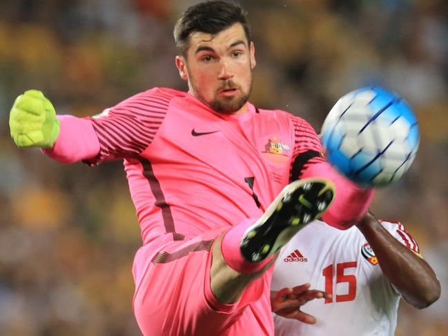 Mathew Ryan of the Socceroos clears the ball as Ismail Al Hammadi closes in  from  during the Socceroos v United Arab Emirates World Cup qualifier at Allianz Stadium, Sydney. pic Mark Evans