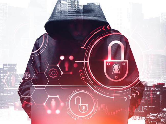 Unrecognizable young hacker in hoodie using laptop in blurry city. Concept of cybersecurity. Toned image. Double exposure of security interface