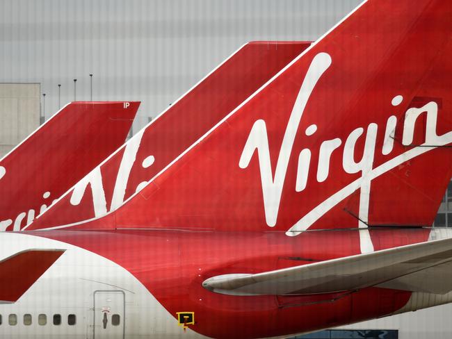 Virgin Atlantic Airline planes are pictured at the apron at Manchester Airport in north-west England, on June 8, 2020, as the UK government's planned 14-day quarantine for international arrivals to limit the spread of the novel coronavirus begins. (Photo by Oli SCARFF / AFP)