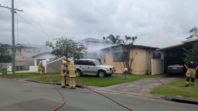 Emergency services rushed to a fire on Nevenia St, Labrador on March 25. The home was destroyed in the inferno, which police believe may have been sparked by a lithium ion battery in an e-bike. Picture: Alex Treacy.