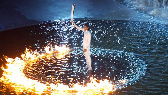 Cathy Freeman lights the cauldron at the 2000 Sydney Olympic Games.