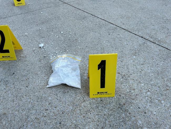 A bag of coke worth $40k was thrown from a high rise apartment in Melbourne during a drug raid. picture Vic Police