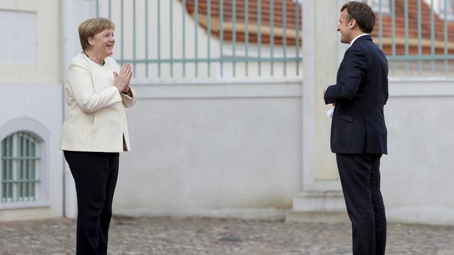 Angela Merkel, left, welcomes Emmanuel Macron at the German government's guest house Meseberg Castle in Gransee near Berlin. Picture: AP