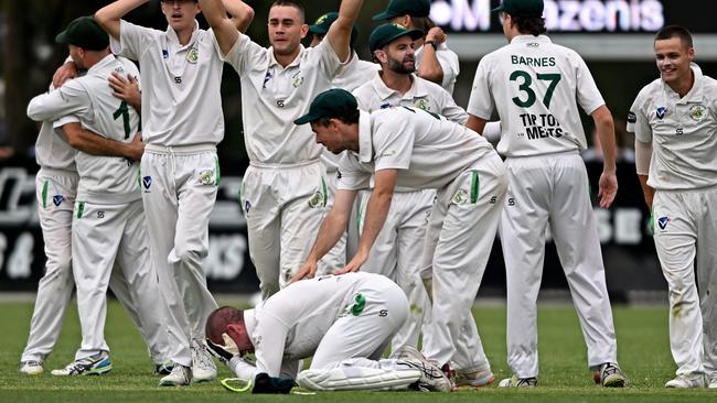 Spotswood players celebrate after winning the match by one run. Picture: Andy Brownbill