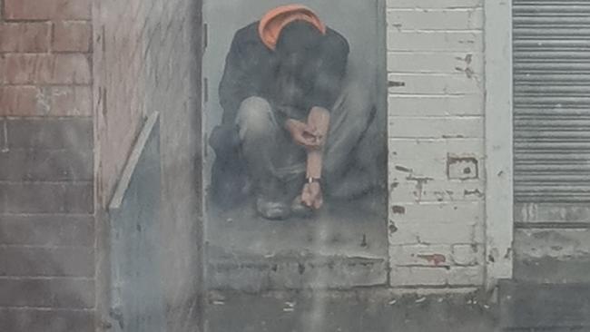 A man injecting himself in the Boyd Lane alleyway way in Dandenong last year. Picture: Supplied