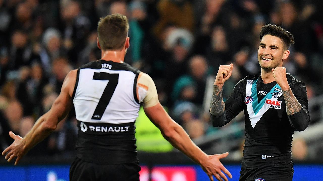 Chad Wingard celebrates a goal with Brad Ebert at Adelaide Oval.