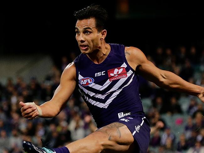 PERTH, WESTERN AUSTRALIA - AUGUST 05: Danyle Pearce of the Dockers kicks the ball during the round 20 AFL match between the Fremantle Dockers and the Gold Coast Suns at Domain Stadium on August 5, 2017 in Perth, Australia.  (Photo by Will Russell/AFL Media/Getty Images)