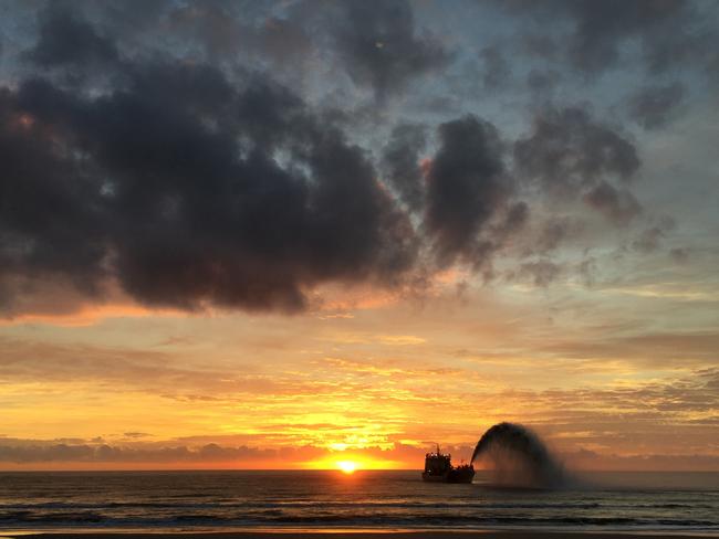 Morning sunrise with sand dredge Picture by Dan