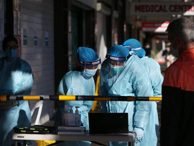 Medical staff assist locals queuing at a medical centre to undertake COVID-19 testing in Fairfield in 2021 in Sydney, Australia. Picture: Lisa Maree Williams/Getty Images.