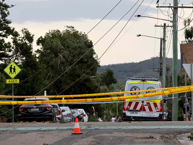 An ambulance on Ocean Street in Narrabeen after the storm ripped through the northern beaches. Picture: Damian Shaw