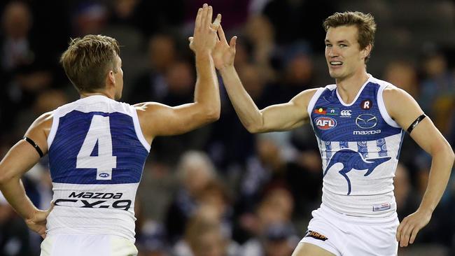 Shaun Higgins (left) and Kayne Turner celebrate a goal for the Roos. Picture: Getty Images