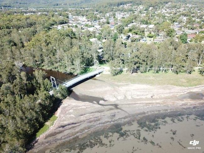 Aerial drone photo showing how badly silted up the mouth of Tumbi Creek had become before floods in February. Picture: Shay Giblin