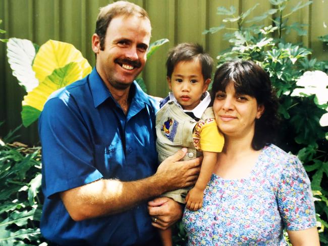 Just after his adoption with Mike and Dora Remkes. Picture: Calum Robertson