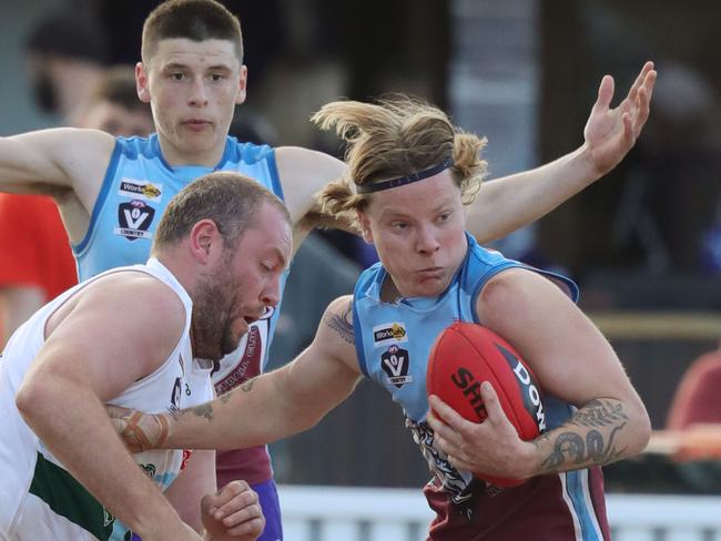 Football BFNL - Geelong Amateur v ModewarreModewarre 5 Oscar Cooke gets away from Geelong Amateur 14 Lachlan Devine Picture: Mark Wilson