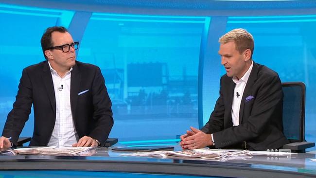 Damian Barrett and Kane Cornes clash. Photo: Channel 9