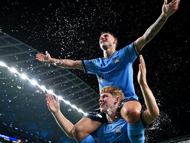 SYDNEY, AUSTRALIA - JANUARY 11: Adrian Segecic and Jaiden Kucharski of Sydney FC celebrate victory during the round 13 A-League Men match between Sydney FC and Central Coast Mariners at Allianz Stadium, on January 11, 2025, in Sydney, Australia. (Photo by Albert Perez/Getty Images) *** BESTPIX ***