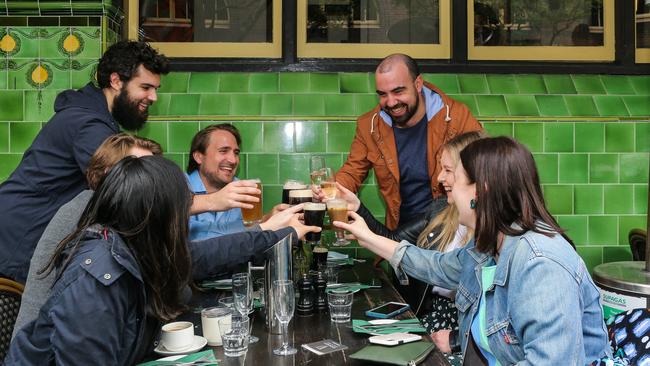 A group of friends enjoy their first pub drink in months in Sydney on Freedom Day. Picture: NCA NewsWire