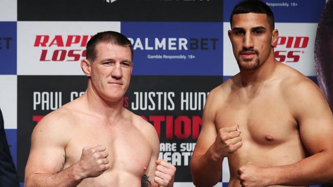 Paul Gallen (L) and Justis Huni (R) face off during the official weigh-in