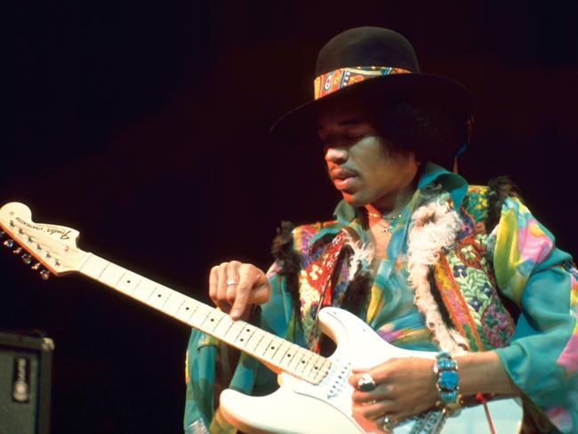 Rock legend Jimi Hendrix performs with his Fender guitar.