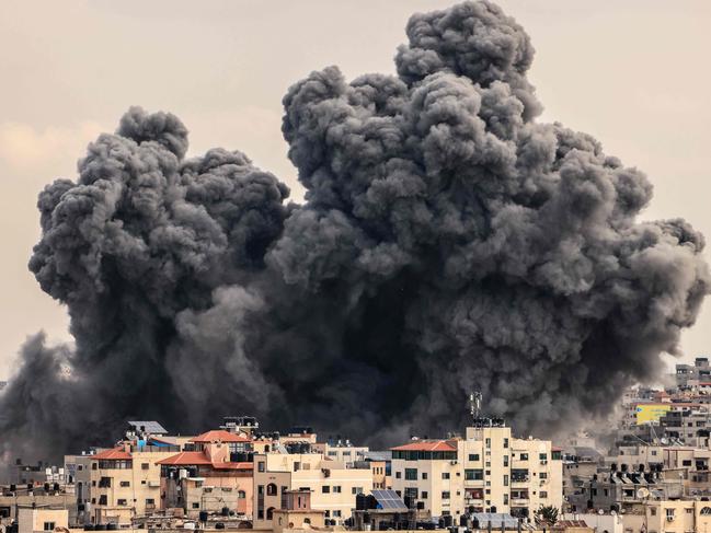 A plume of smoke rises in the sky of Gaza City during an Israeli air strike on October 9. Picture: Mahmud Hams/AFP
