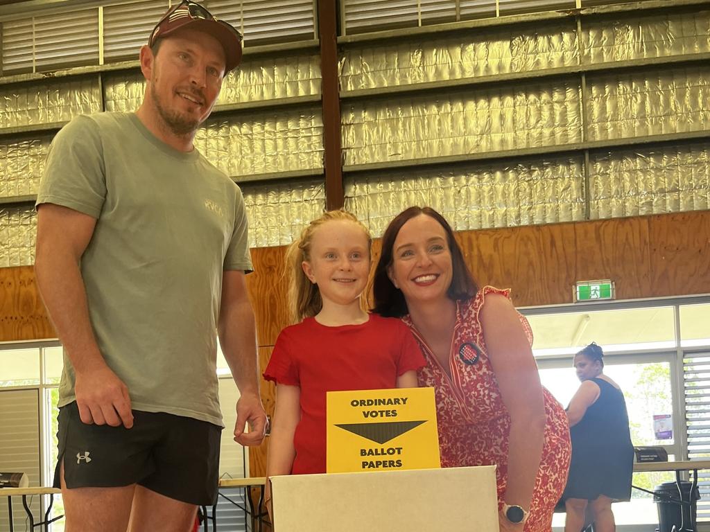 Labor Keppel MP Brittany Lauga voting for the third time at Mount Archer State School during her parliamentary career with her daughter and partner in tow.