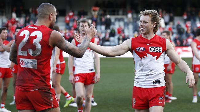 Callum Mills celebrates with Lance Franklin after his career-best return. Picture: Daniel Pockett/AFL Photos/via Getty Images