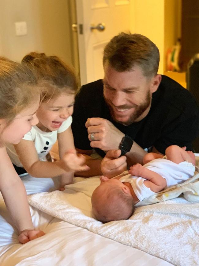 David Warner with his daughters.