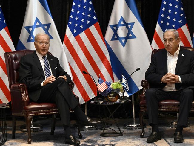 TOPSHOT - US President Joe Biden (L) listens to Israel's Prime Minister Benjamin Netanyahu as he joins a meeting of the Israeli war cabinet  in Tel Aviv on October 18, 2023, amid the ongoing battles between Israel and the Palestinian group Hamas. US President Joe Biden landed in Tel Aviv on October 18, 2023 as Middle East anger flared after hundreds were killed when a rocket struck a hospital in war-torn Gaza, with Israel and the Palestinians quick to trade blame. (Photo by Brendan SMIALOWSKI / AFP)