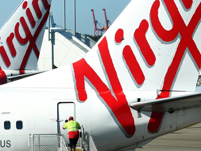 A stock image of Virgin Australia aircrafts at Brisbane Airport, Brisbane, Wednesday, August 29, 2018. Virgin Australia has today posted a full-year loss of $681 million. (AAP Image/Dan Peled) NO ARCHIVING