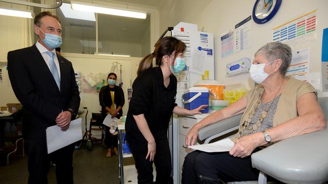 Health Minister Greg Hunt watches on as Anne Hyslop receives her COVID vaccine from nurse Youri Park. Picture: NCA NewsWire / Andrew Henshaw