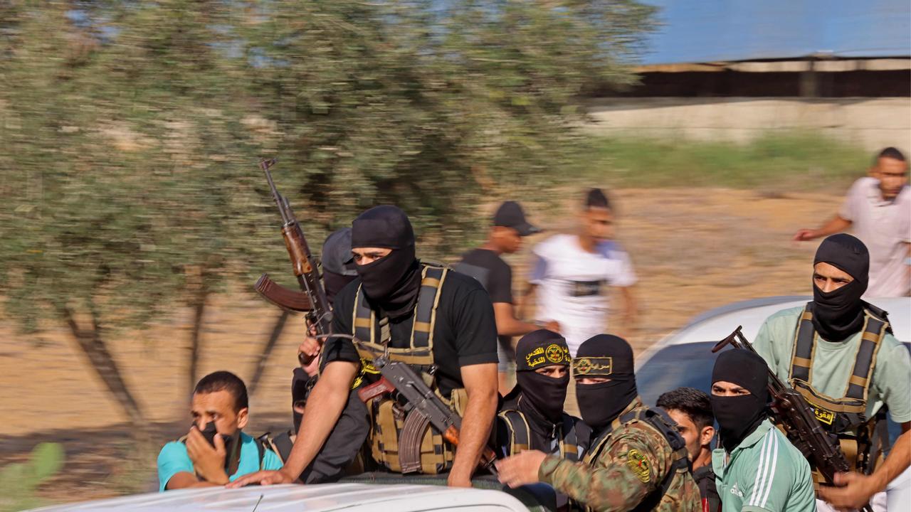 Palestinian militants move towards the border fence with Israel from Khan Yunis in the southern Gaza Strip. Picture: Said Khatib / AFP