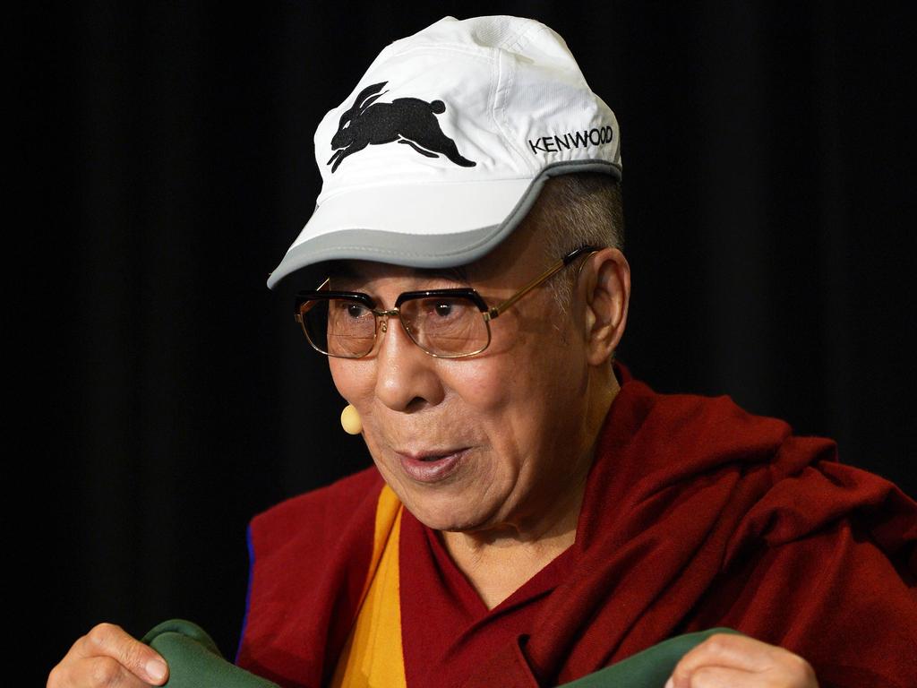 Who knew the Dalai Lama was a Souths fan? Picture: AFP PHOTO/ Greg WOOD