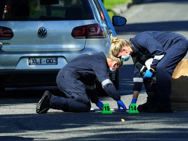 Forensic crews at the scene of the shooting. Picture: Luis Enrique Ascui