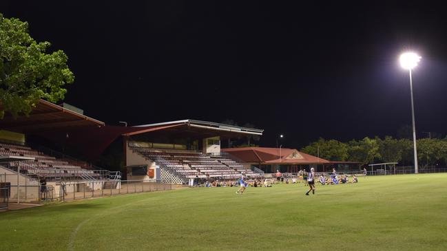 Players from the Banks Bulldogs and Tiwi Bombers train under the new lights at Gardens Oval. Picture: Will Zwar