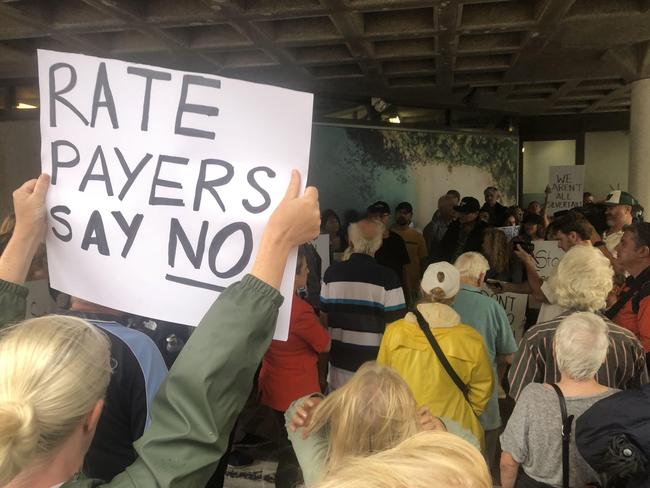 Ratepayers at the council meeting protest over proposed rate increases. Picture: Jim O’Rourke